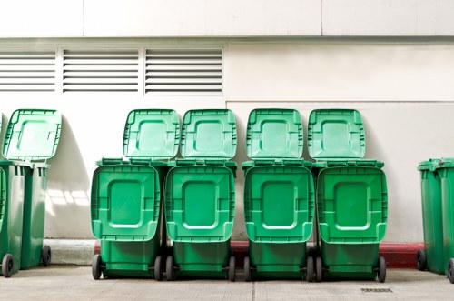 Workers handling cleared office materials